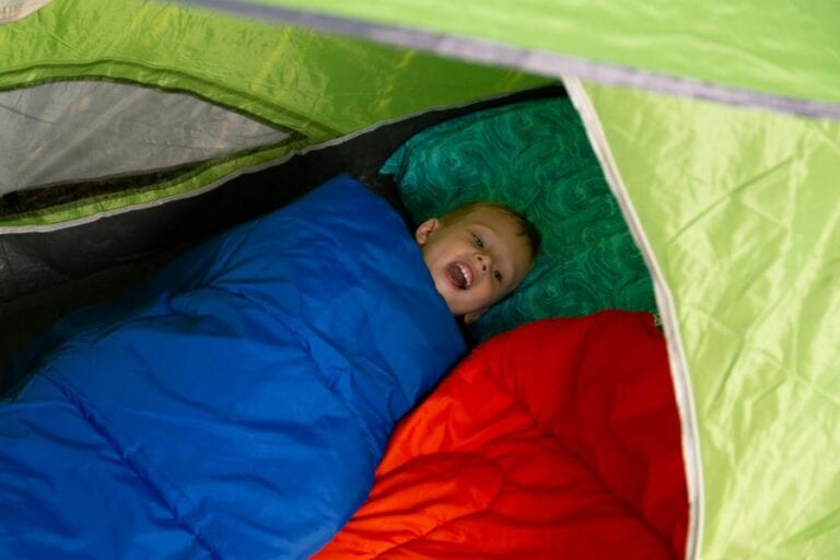 Child in Sleeping Bag in Tent