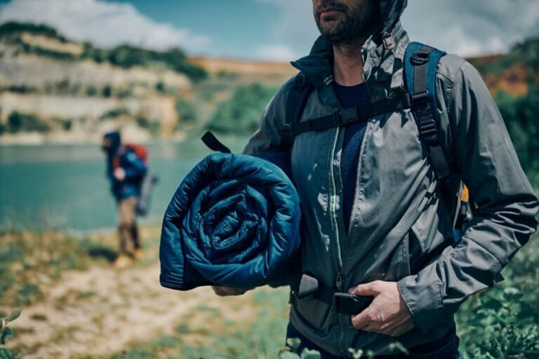 Man Carrying Sleeping Bag