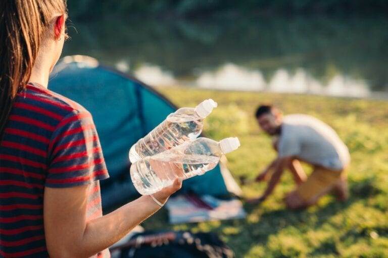 Holding Bottled Water While Camping