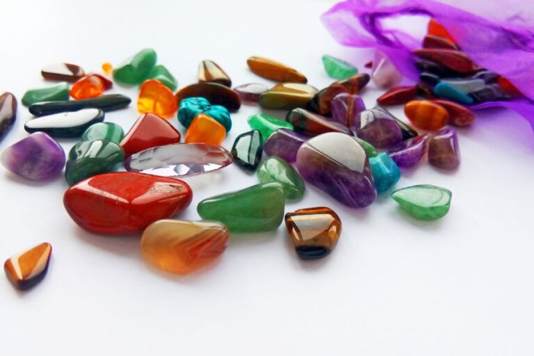 Scattered Polished Stones With Purple Bag