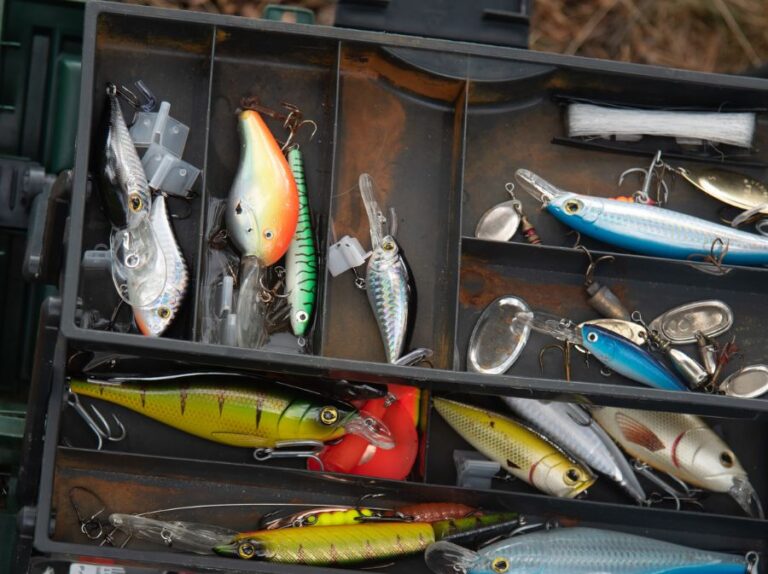 Various Colorful Fishing Lures in an Old Tackle Box