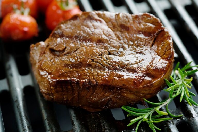 Steak Cooking on a Grill