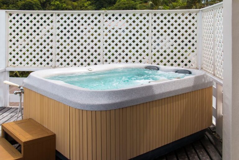 Wooden Hot Tub With Swirling Water on a Deck