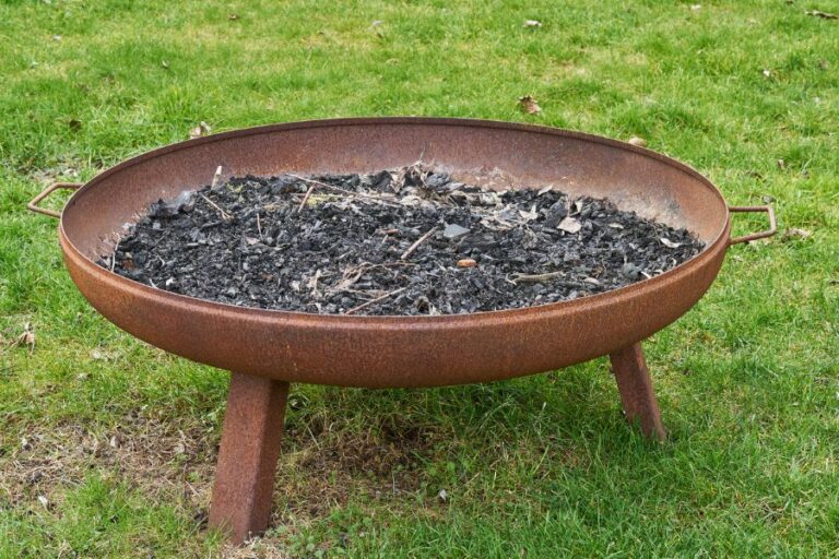 Rusty Fire Pit With Ashes in Bottom