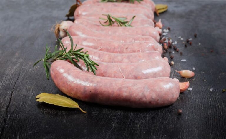 Uncooked Pork Sausages in Casings on Black Background