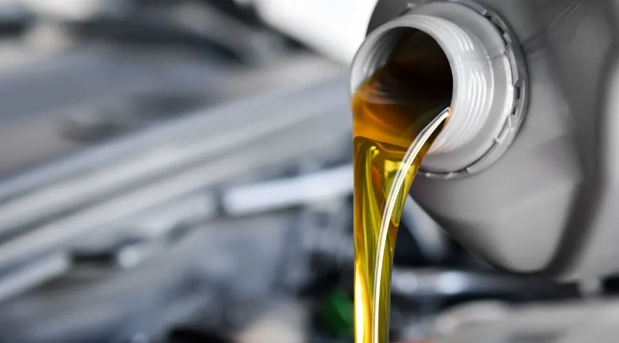 Pouring Motor Oil Into Engine