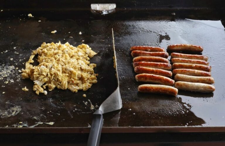 Cooking Scrambled Eggs and Sausage on a Griddle