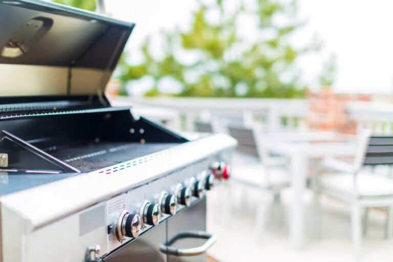 Six Burner Gas Grill With Open Lid Outdoors