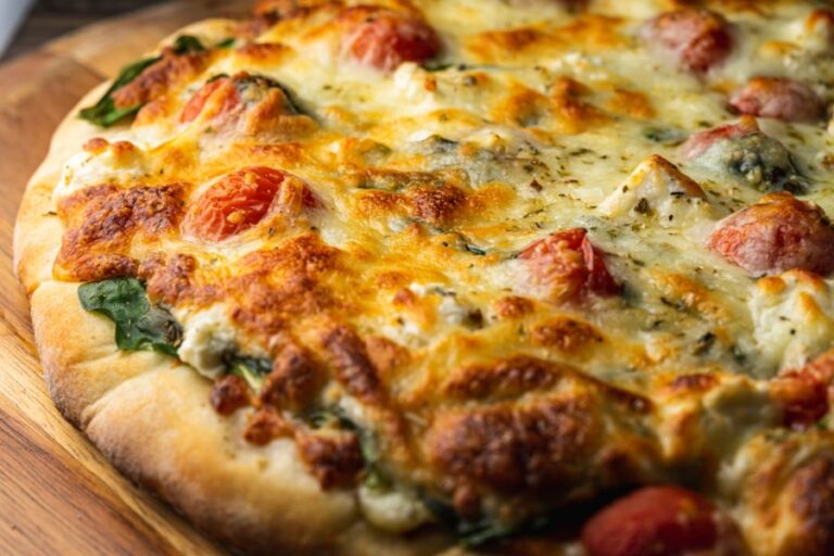 Vegetarian Pizza Fresh From the Oven on a Wooden Pizza Peel