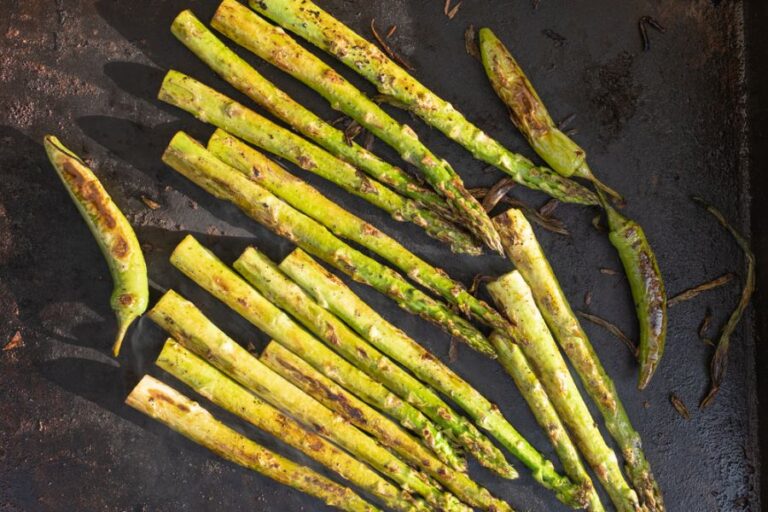 Asparagus and Hot Peppers Cooking on a Griddle