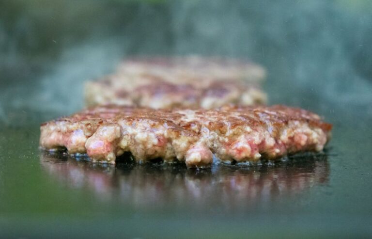 Burger Meat Sizzling on a Griddle