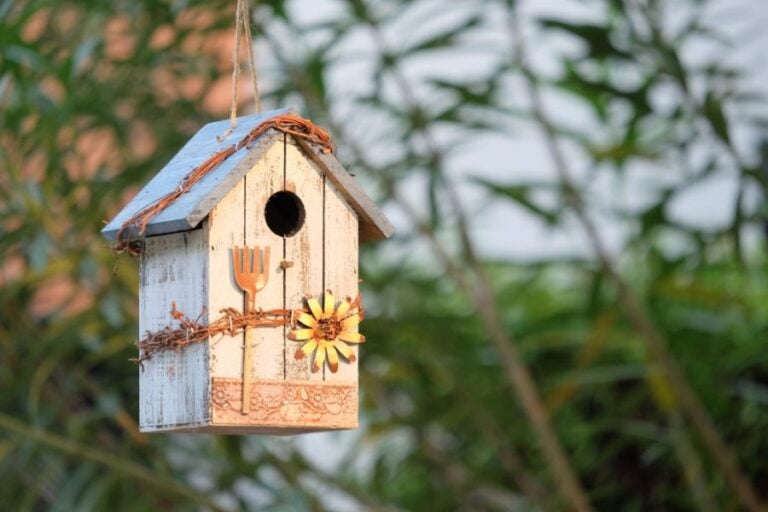 Decorative Birdhouse Hanging From a Tree