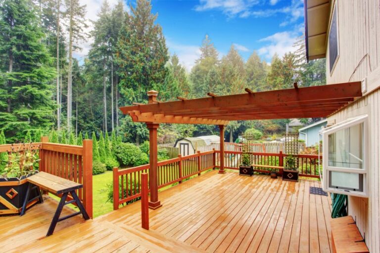 Large Wooden Deck With an Attached Pergola