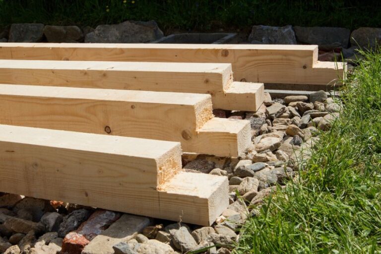 Several Pieces of a Pergola Being Built