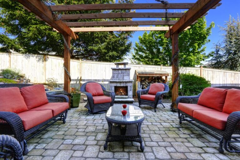 Backyard Pergola With a Stone Oven and Patio Furniture