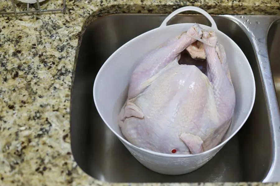 Thawing Turkey In A Bucket In The Sink