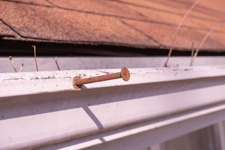 Gutter Nail Sticking Out of a Gutter