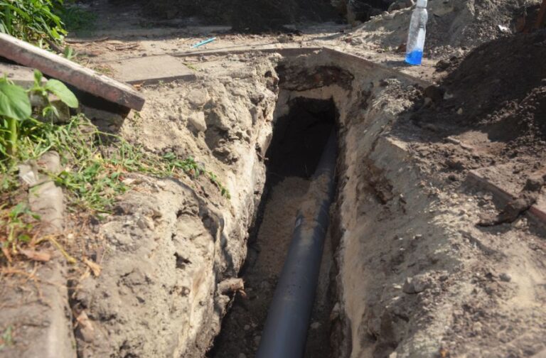 Installing an Underground Downspout Drain Line in the Ground