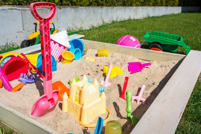 Kids' Sandbox Filled With Toys