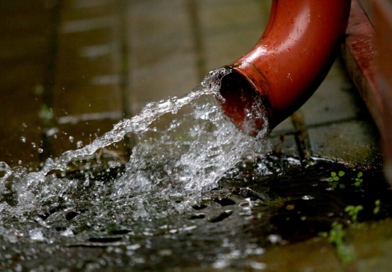 Water Pouring Out of a Downspout