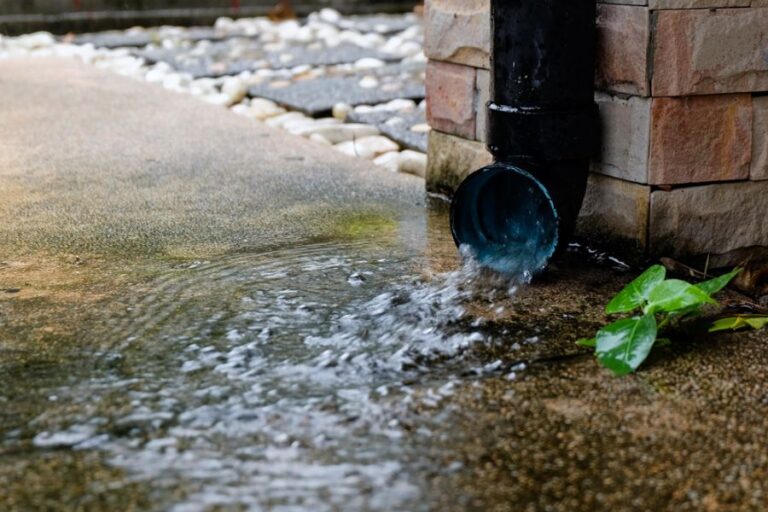 Lots of Rainwater Flowing from a Downspout