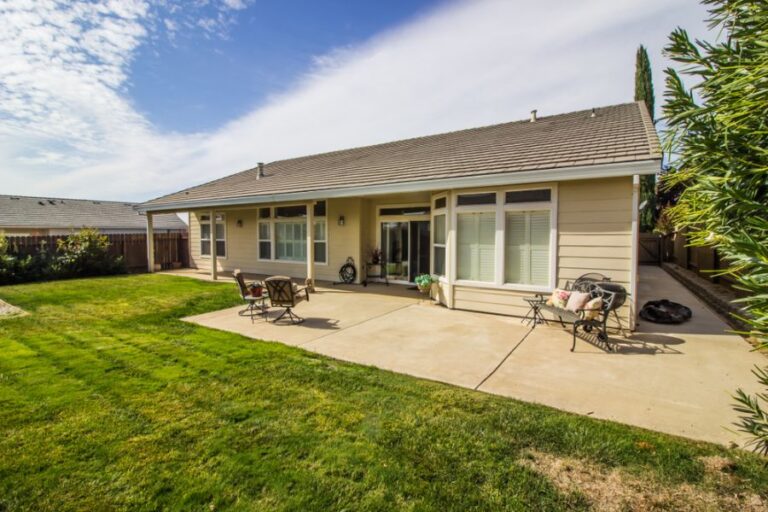 Large Concrete Patio Behind a House