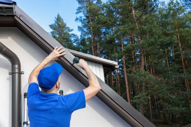 Man Installing Metal Drip Edge on a Roof