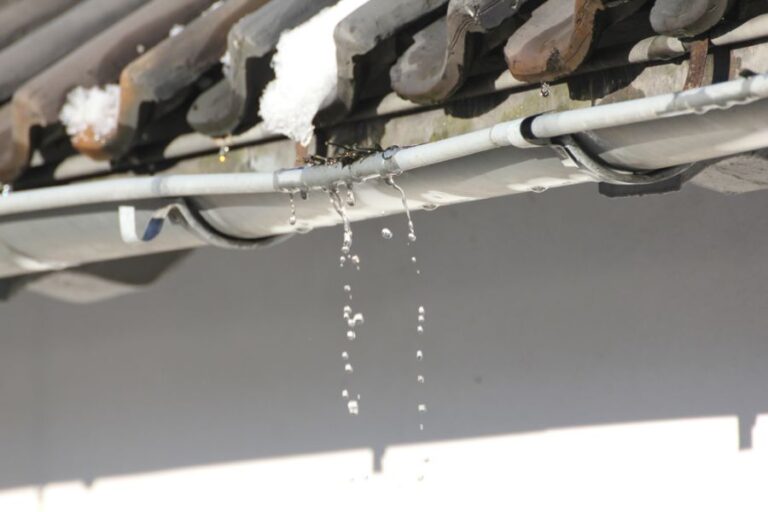Water Running From Damaged Rain Gutter