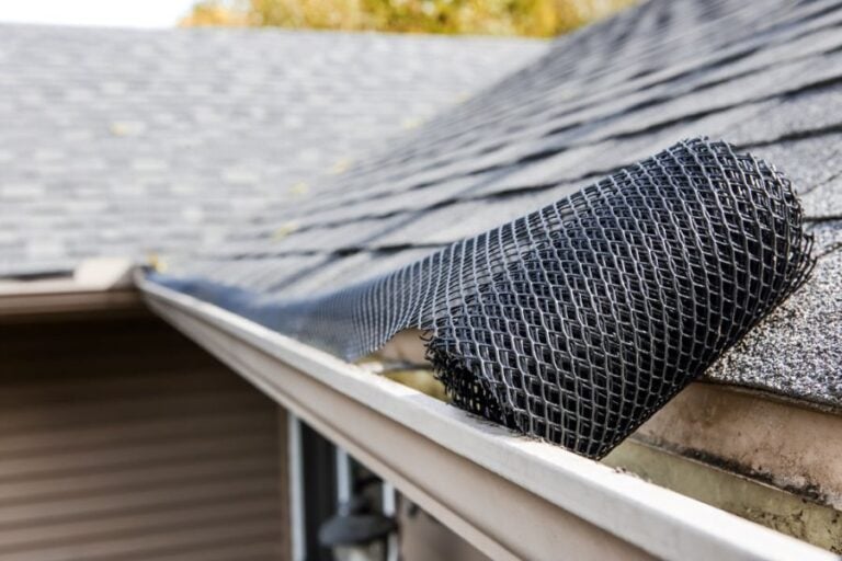 Gutter Cover Being Rolled on a Gutter
