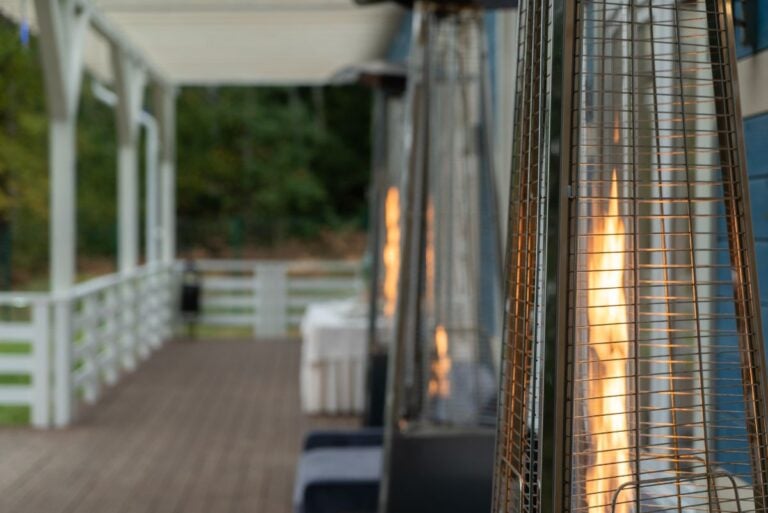 Several Pyramid Style Patio Heaters on the Front Porch