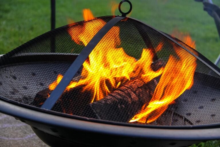 Closeup of Burning Wood in a Metal Mesh Firepit