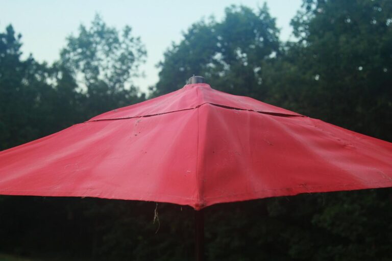 Faded and Ratty Red Patio Umbrella