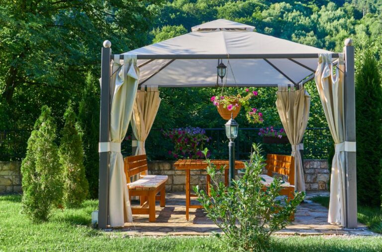 Gazebo With Curtains Over a Backyard Patio