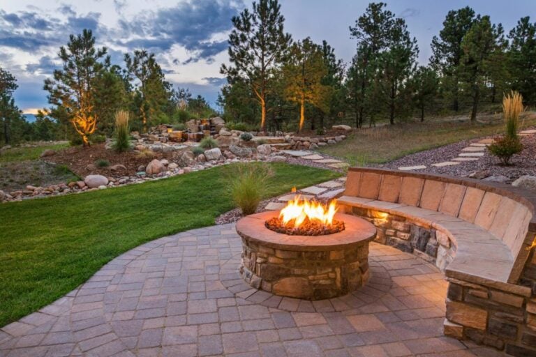 Fire Burning in a Fire Pit Built into a Patio With Seating