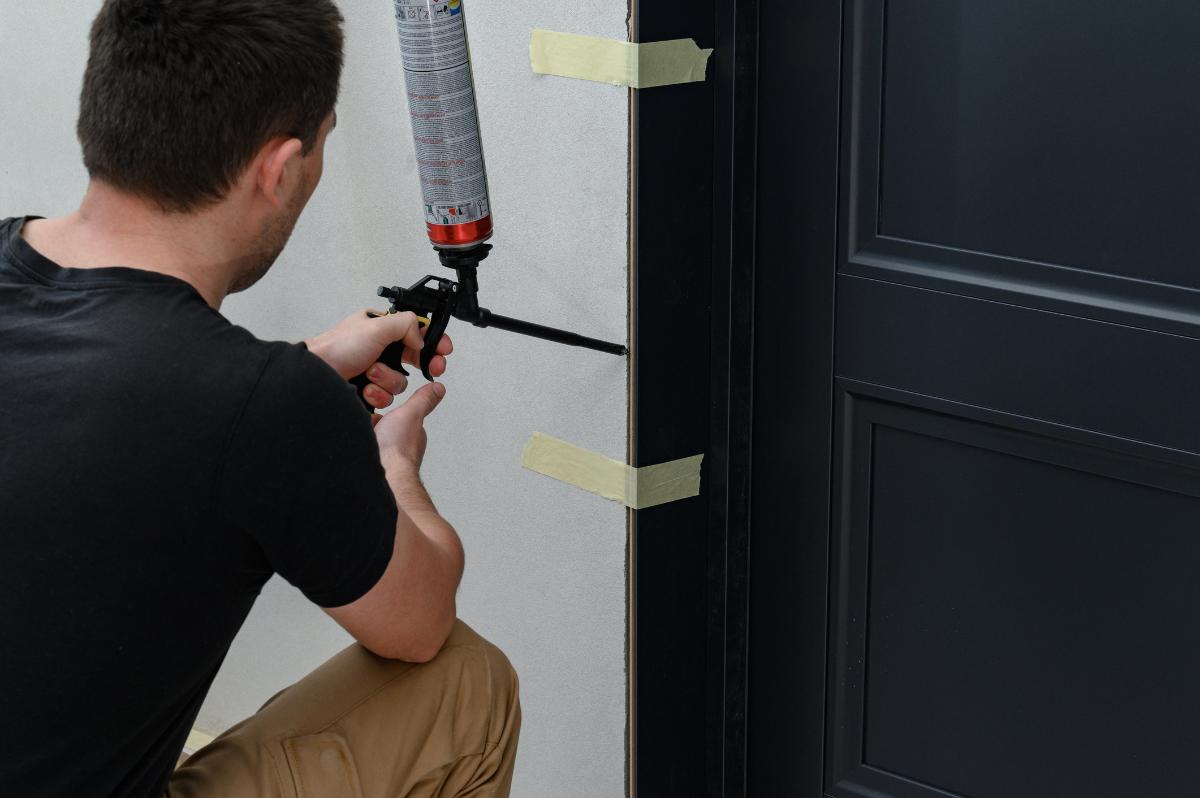 Spraying foam around door